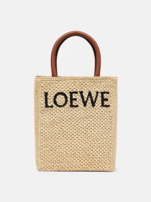 Leather-trimmed raffia tote bag