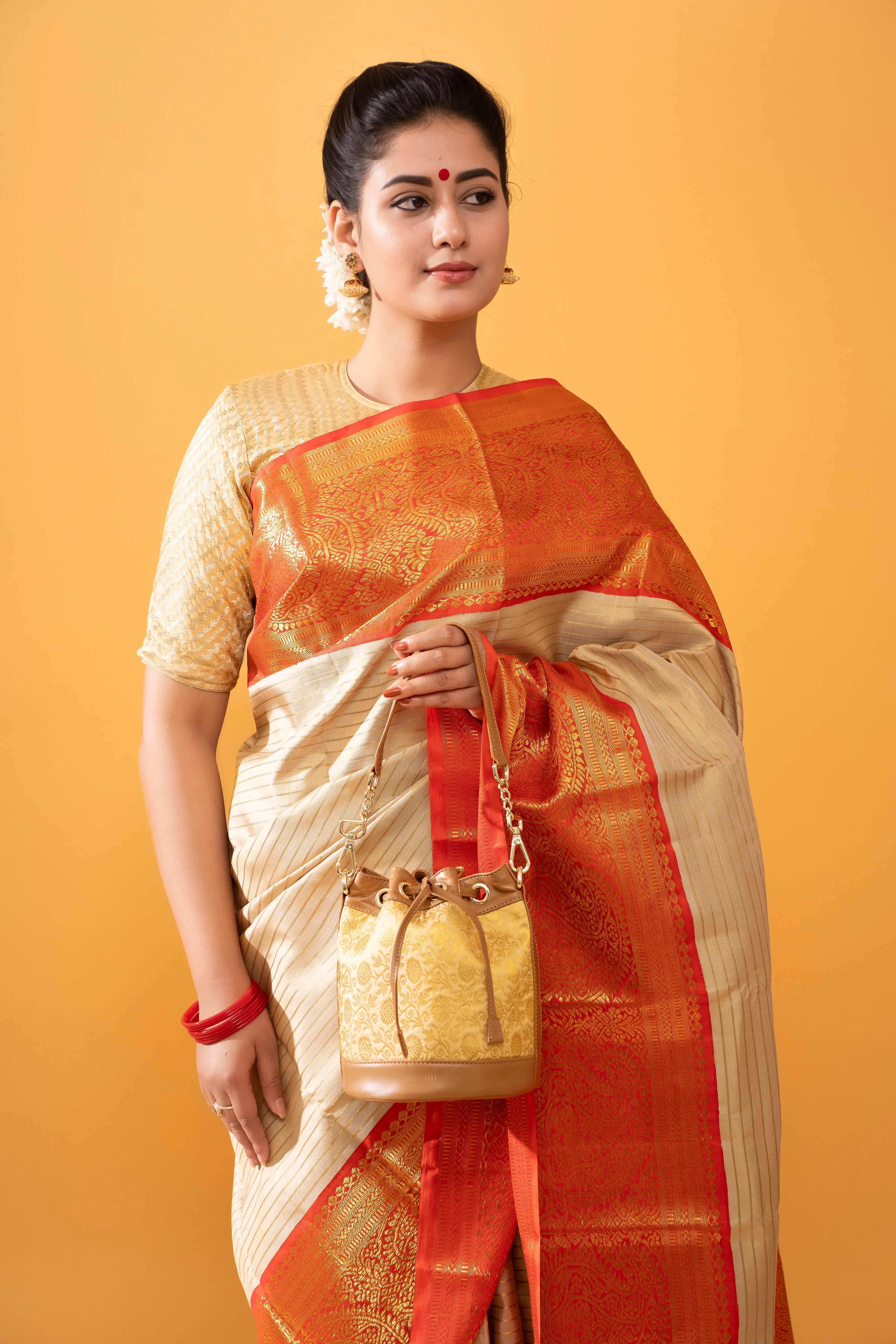 Yanay Kanchi Brocade Potli Gold & Tan