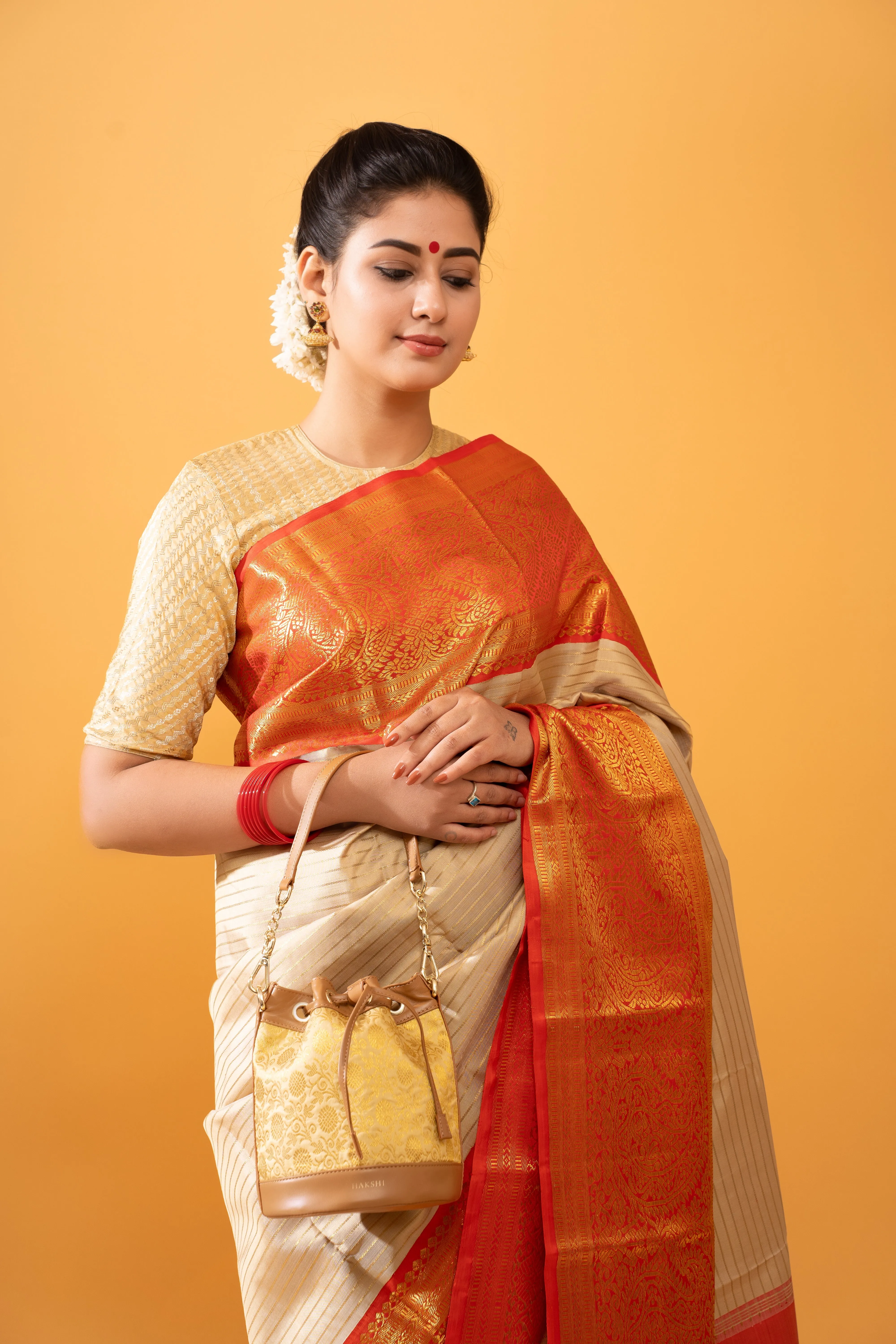 Yanay Kanchi Brocade Potli Gold & Tan